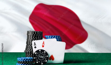 Japan casino theme. Two ace in poker game, cards and black chips on green table with national flag background. Gambling and betting.
