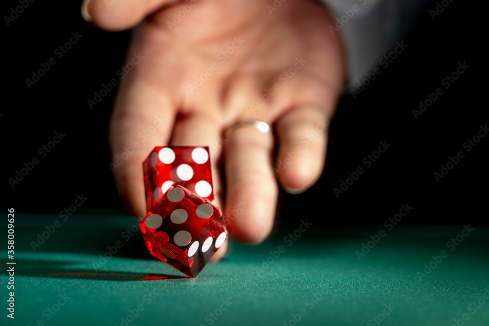 Man gambling at the craps table