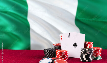 Nigeria casino theme. Aces in poker game, cards and chips on red table with national flag background. Gambling and betting.
